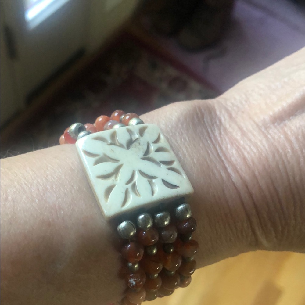 Elegant Beaded Bracelet with Carved Centerpiece
